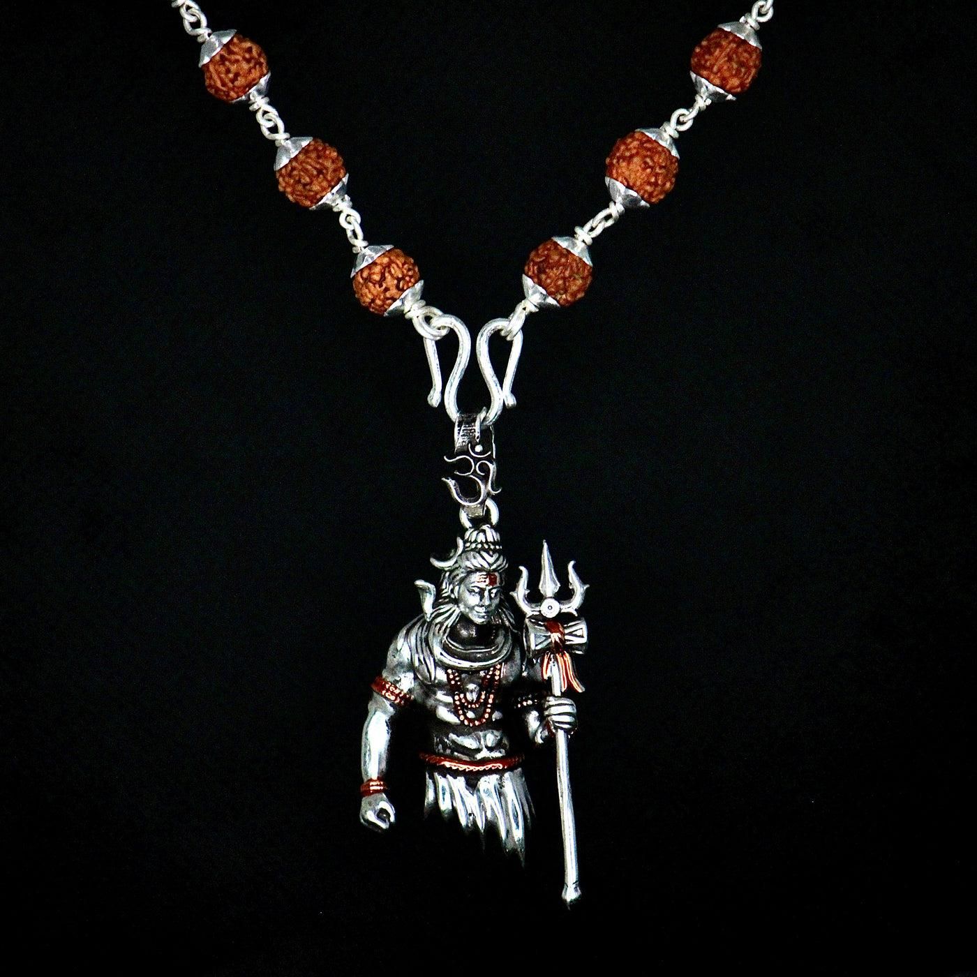 Necklace with a pendant of a warrior figure on a black background