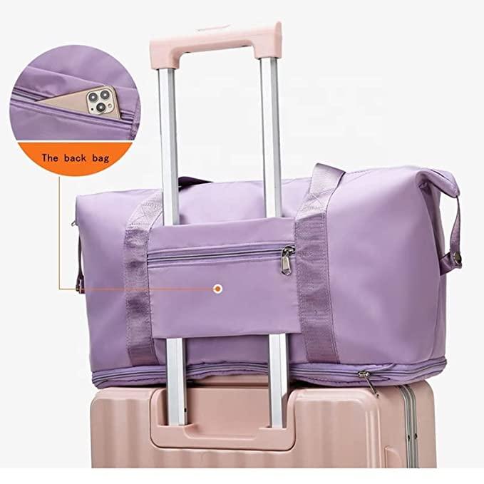 Purple travel bag attached to a suitcase with a close-up of the back bag feature.