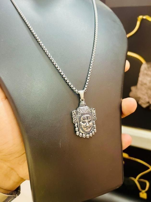 Silver pendant necklace on a mannequin bust